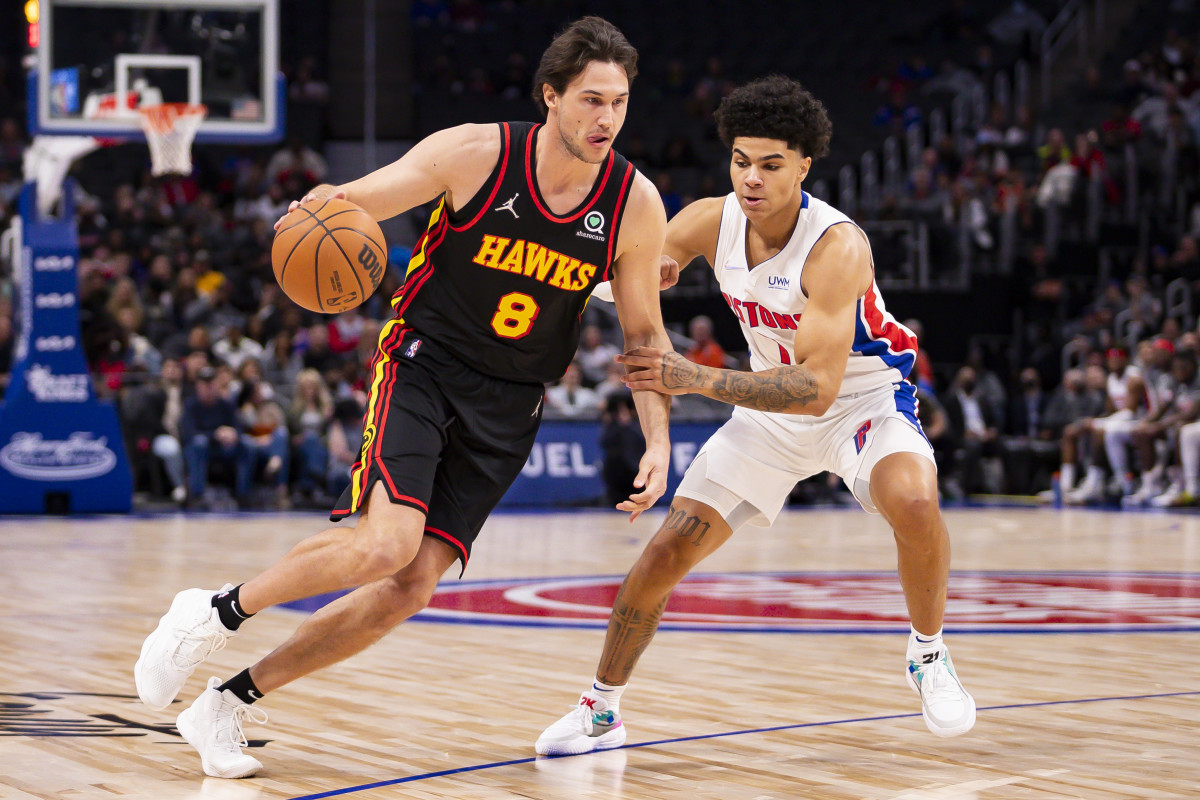 Mar 7, 2022; Detroit, Michigan, USA; Atlanta Hawks forward Danilo Gallinari (8) gets defended by Detroit Pistons guard Killian Hayes (7) during the first quarter at Little Caesars Arena.